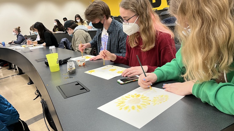 People Painting Flowers
